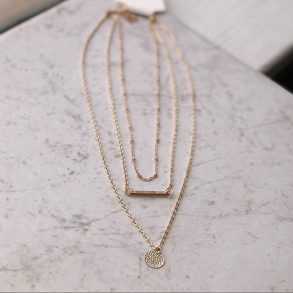 Three chain necklace.